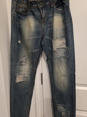 Woman's Distressed Patchwork Blue Jeans